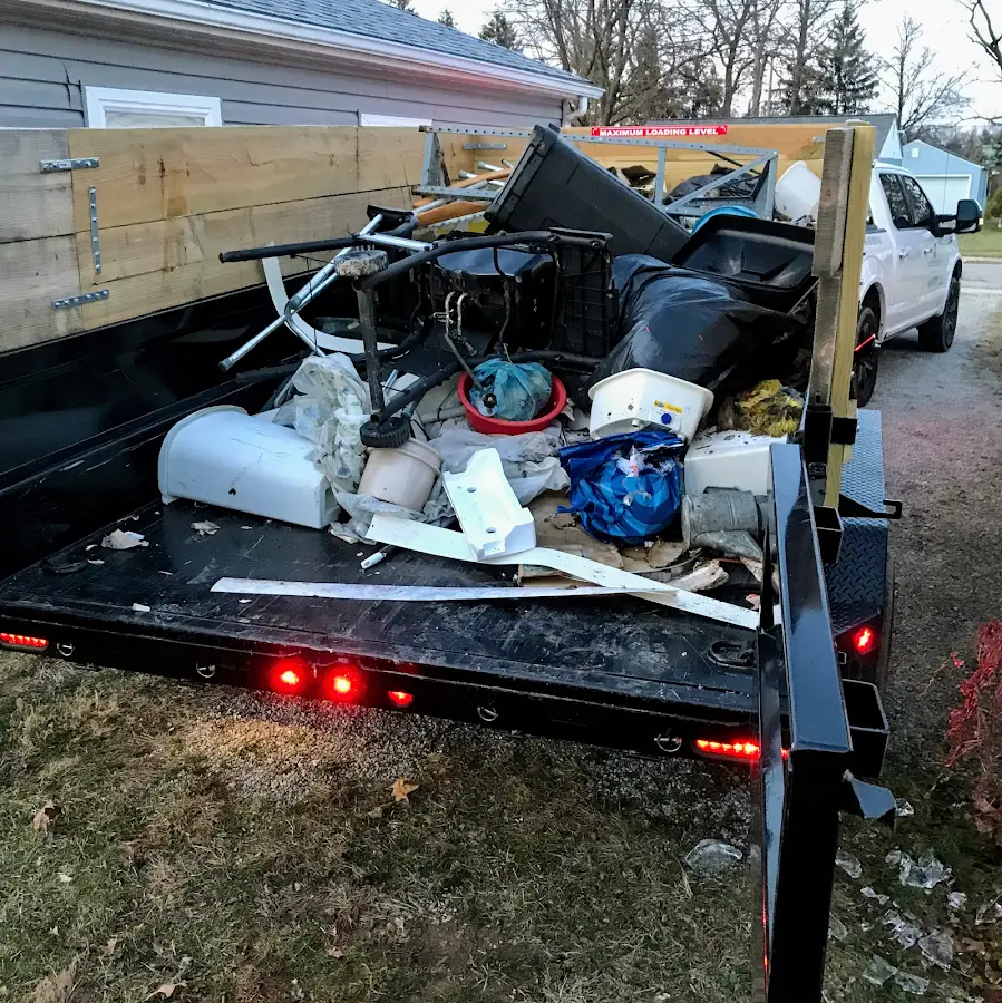 Roll-off dumpster delivered to a residential driveway in Manistee